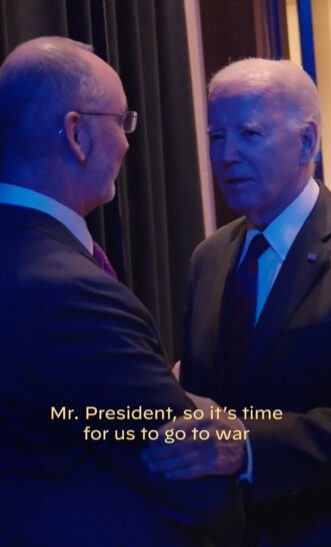 UAW czar Shawn Fain with president Joe Biden and the caption, "Mr. President, it's time for us to go to war"