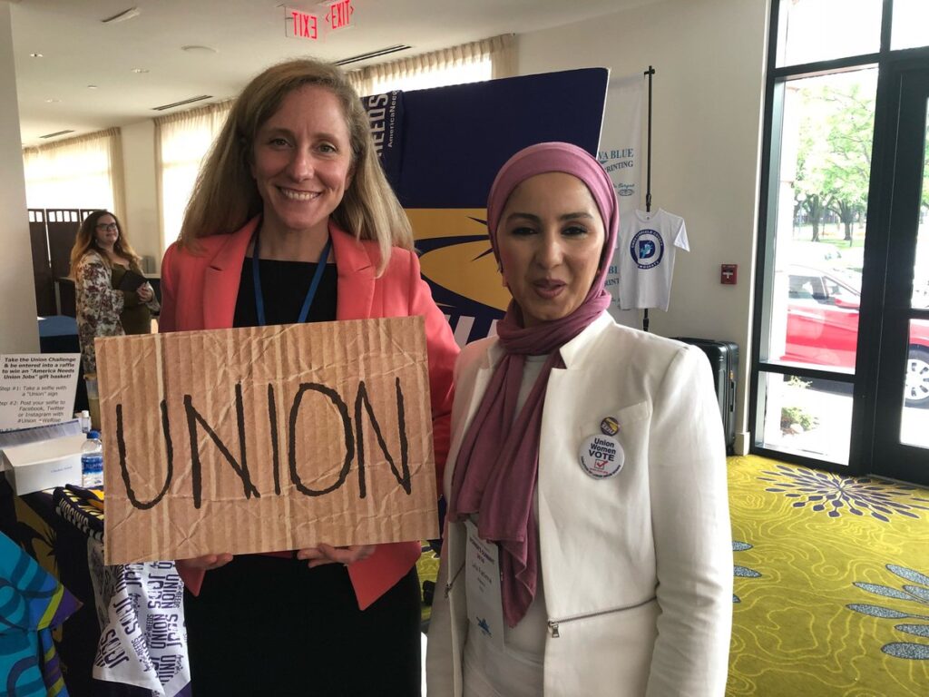 Abigail Spanberger holding a union sign